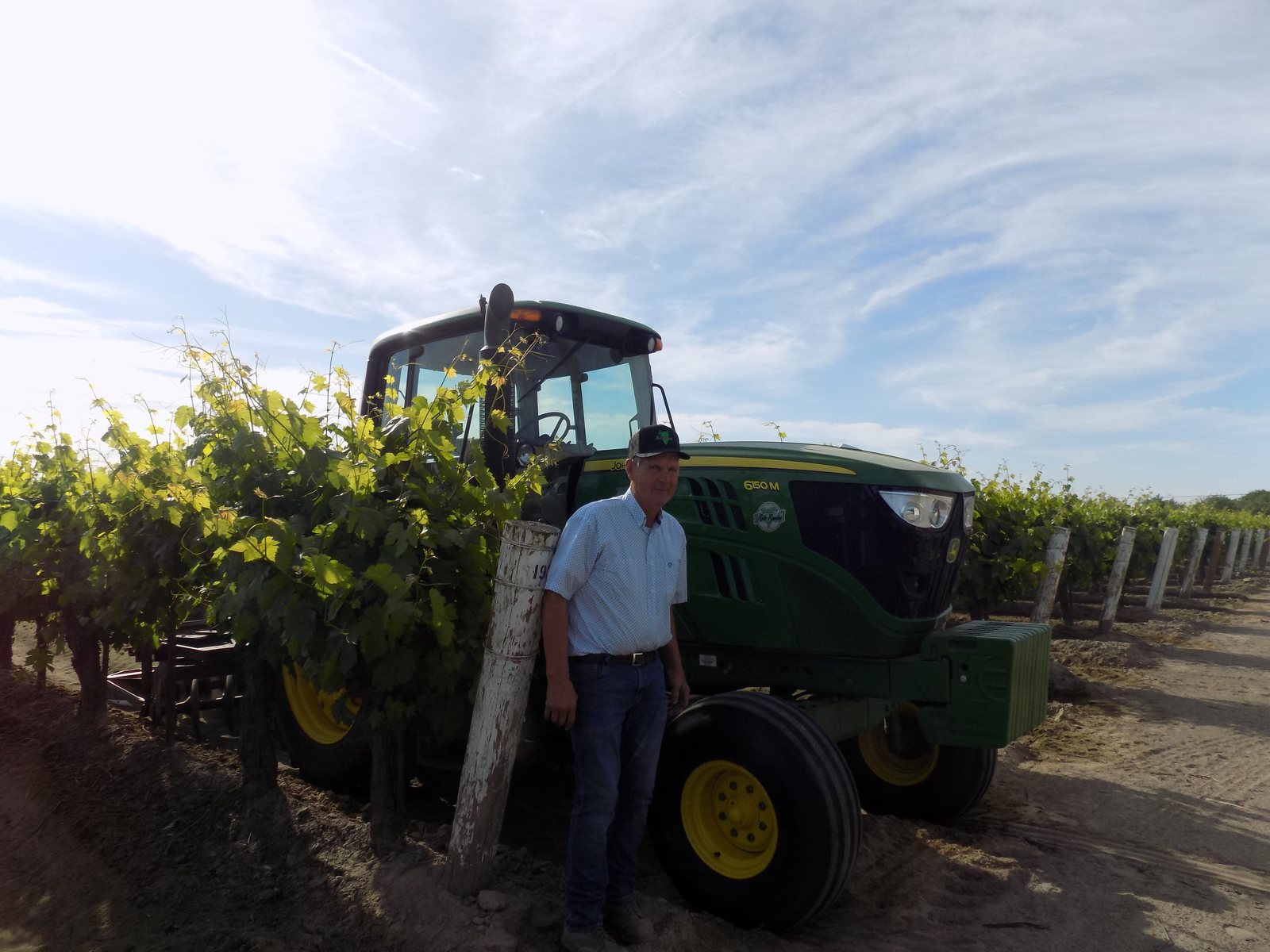 Steve started driving tractors at five years old and still runs them himself, pulling three or four implements at a time to save passes.